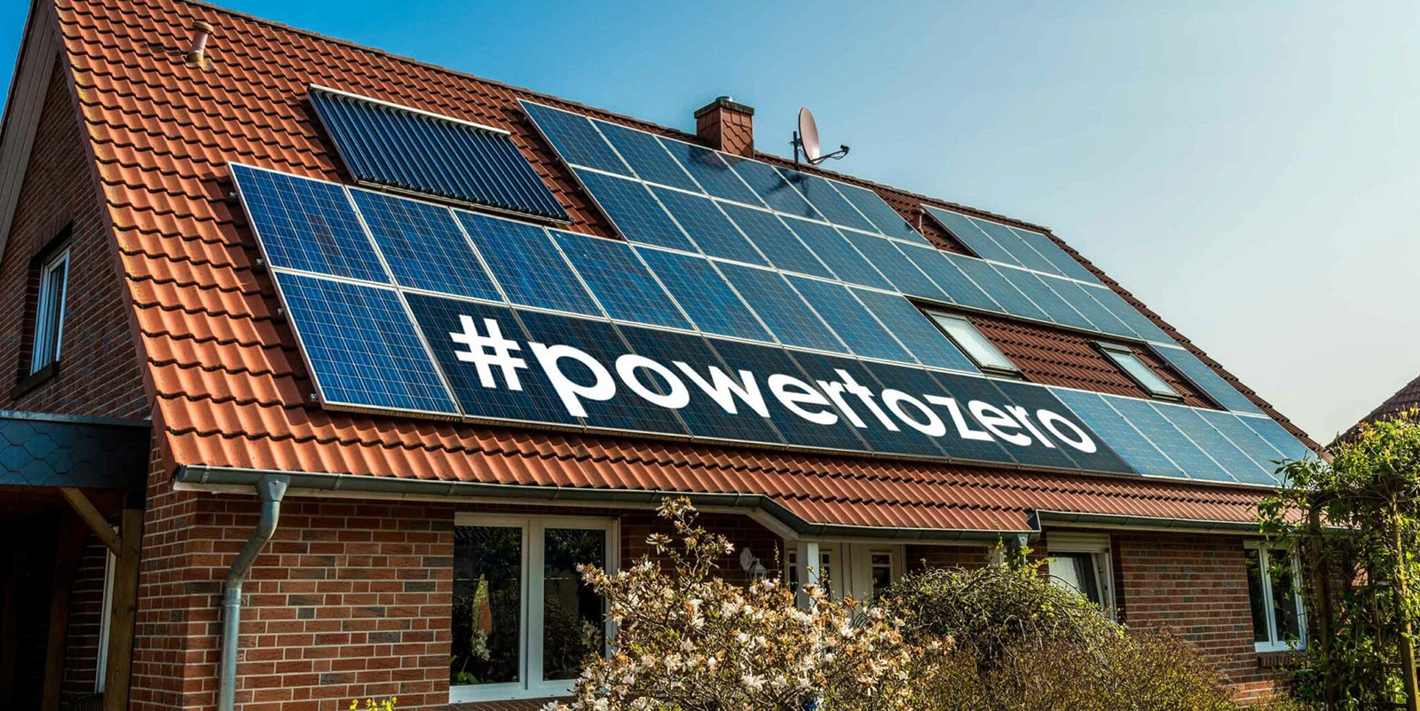 A modern residential roof covered in home solar panels showcasing the Fischer powertozero clean energy home heating transition strategy.