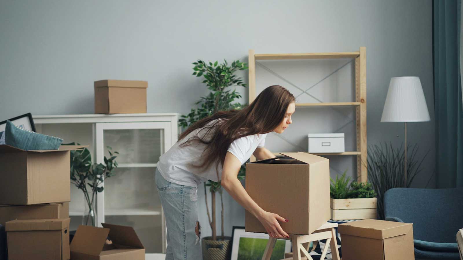 Woman unpacking in new home