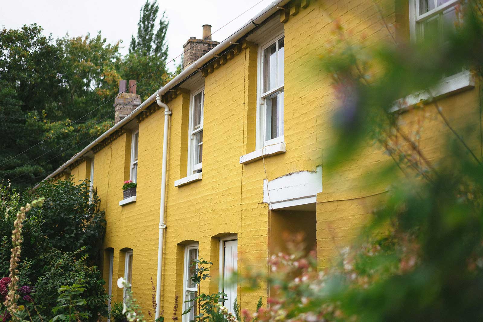 Typical street of older UK terraced houses, representing properties landlords are upgrading to meet EPC Band C 2030 requirements.