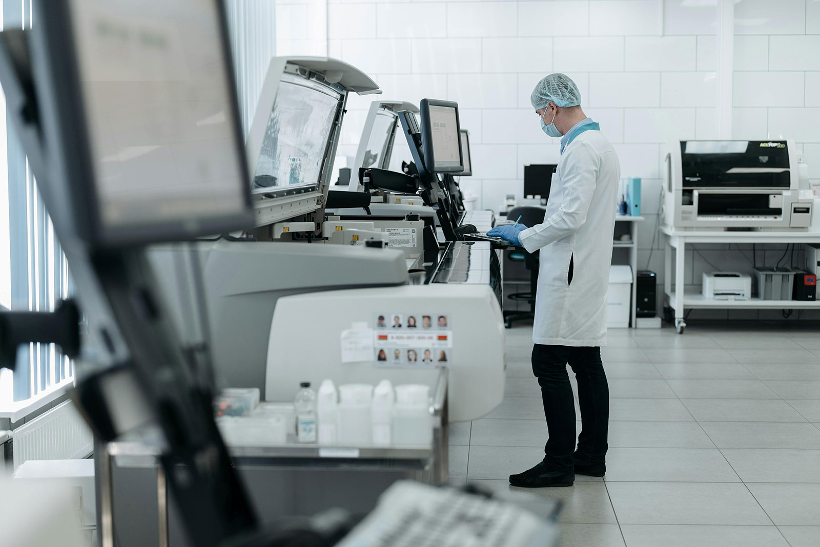 A technician rigorously testing a Fischer electric HeatCore radiator in a modern lab.